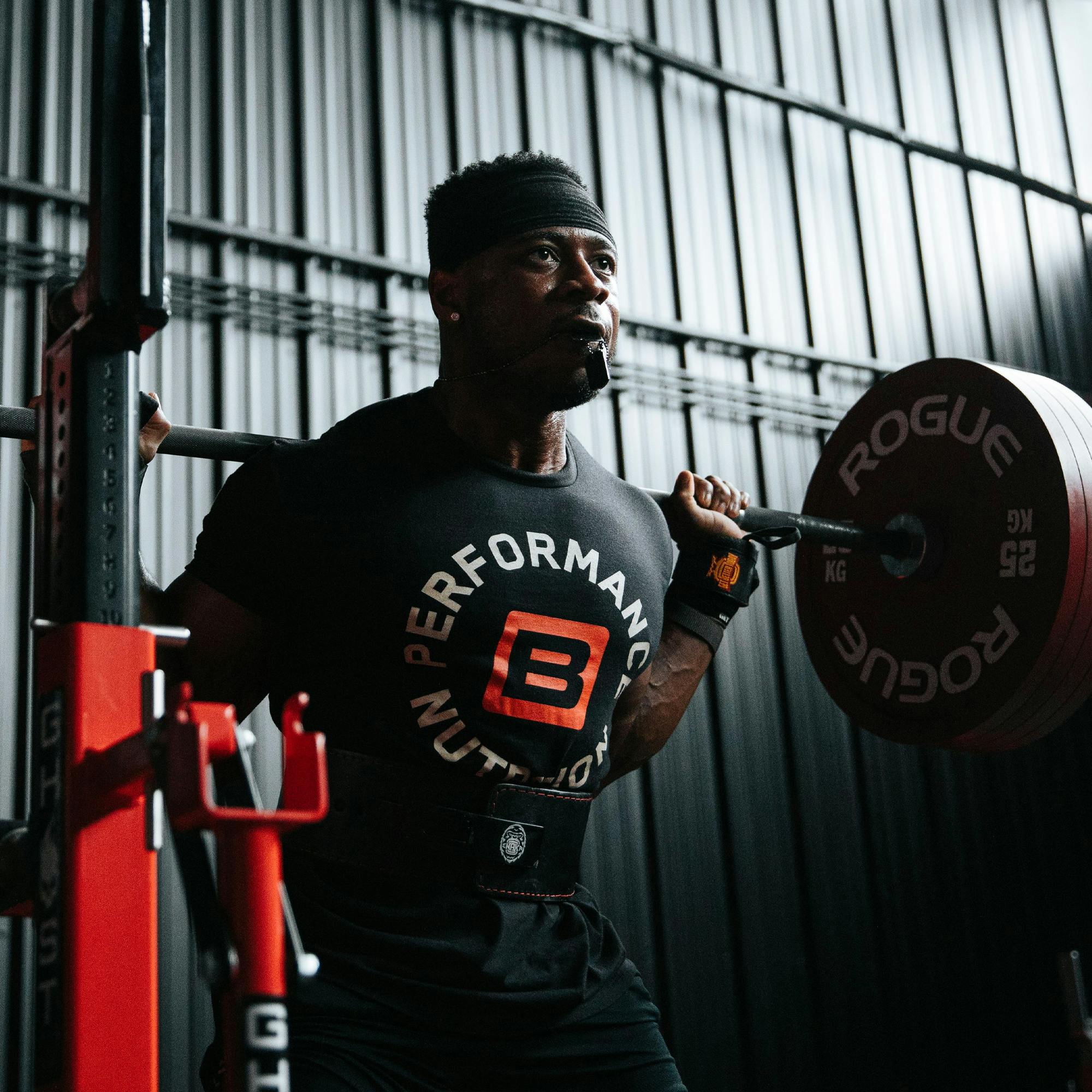 Weight lifter performing a barbell squat